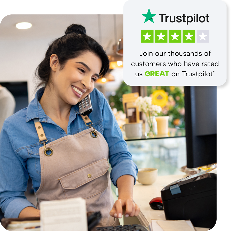 Smiling woman in an apron talks on the phone at a counter, with a Trustpilot rating graphic showing four stars and a message about customer reviews.