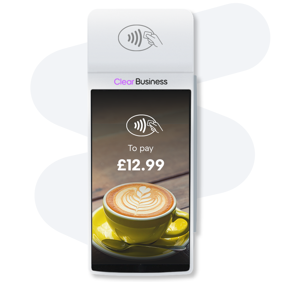 Contactless payment terminal displaying "To pay £12.99" with an image of a latte in a yellow cup and saucer.