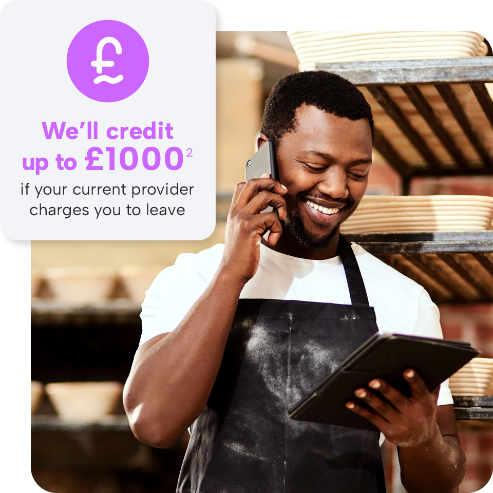 Man in apron smiling while talking on phone and holding tablet; text offers up to £1000 credit if charged for switching providers.